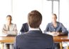 young-man-job-interview-rear-view